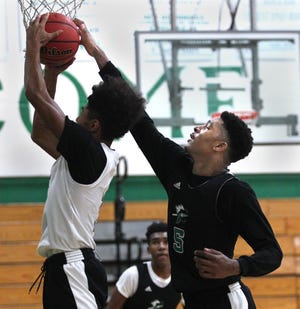 Choctaw's Diante Smith deflects a shot during Thursday's practice. [MICHAEL SNYDER/DAILY NEWS]