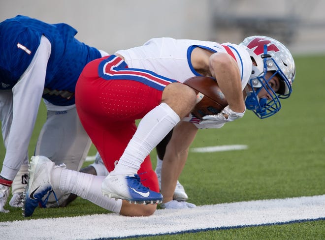 Westlake's Penny Baker scores a touchdown during the first half of Saturday's loss to Beaumont West Brook. Baker caught seven passes for 161 yards. [PAUL BRICK/FOR STATESMAN]