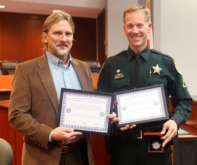 Eustis High Resource Deputy Adam Tytler and Principal Tracy Clark were recognized for their actions in preventing a possible shooting at their school. [Sherri Owens/Lake County Schools]