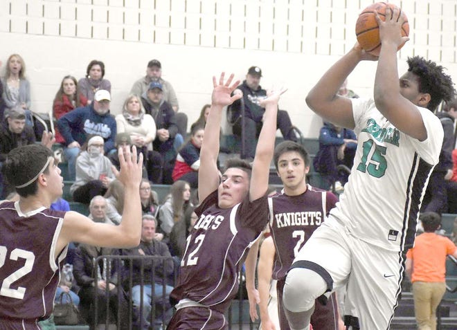 Mardoni Laguerre puts up a shot for Herkimer during the second quarter of Thursday’s game against Frankfort-Schuyler. Defending on the play (from left) are Joe Casamento, Andrew Spina and Michelangelo Spina.        

[Jon Rathbun / Times Telegram]