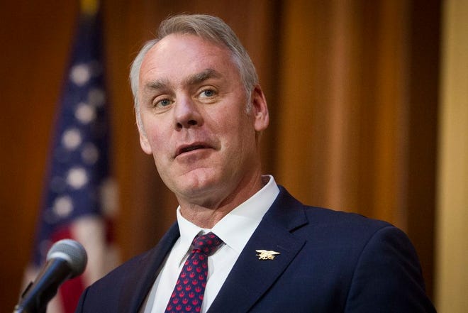 In this Dec. 11, 2018 file photo, Secretary of the Interior Ryan Zinke speaks after an order withdrawing federal protections for countless waterways and wetland was signed, at EPA headquarters in Washington.