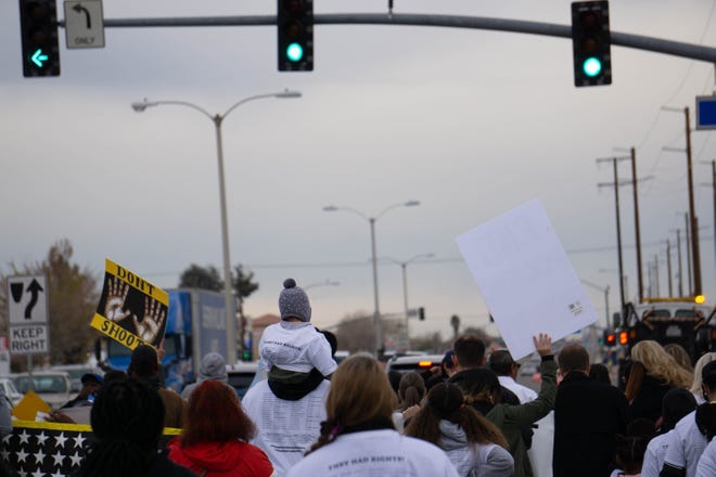 Protestors march along Bear Valley Road as part of a 'March for Justice' against alleged police brutality in Victorville Friday. The march was held to protest what organizers say is a spike in alleged police brutality in the county. [Martin Estacio, Daily Press]