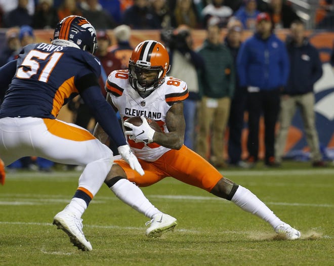 Cleveland wide receiver Jarvis Landry cuts to pick up extra yardage in the win over Denver on Saturday night. [Rick Scuteri/The Associated Press]