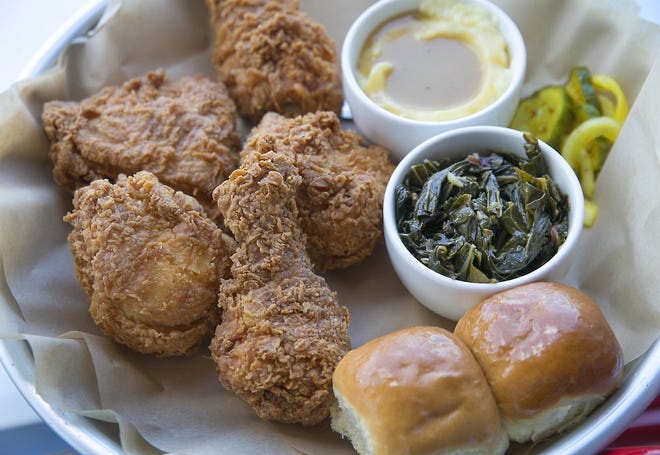 JT Youngbloods Texas Chicken, the legacy fried chicken chain that was rebooted by Lenoir chef Todd Duplechan and his partners, is newly opened in the Mueller development. This is the 5-piece basket with mashed potatoes and gravy and collared greens.

RALPH BARRERA/AMERICAN-STATESMAN