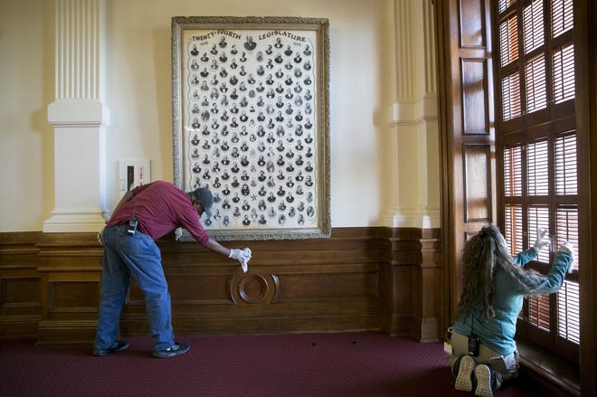 Lloyd White and Maria Rodriguez of the Texas State Preservation Board polish the woodwork in the House Chamber at the Capitol on Dec. 10. The legislative session begins on Jan. 8. [JAY JANNER/AMERICAN-STATESMAN]