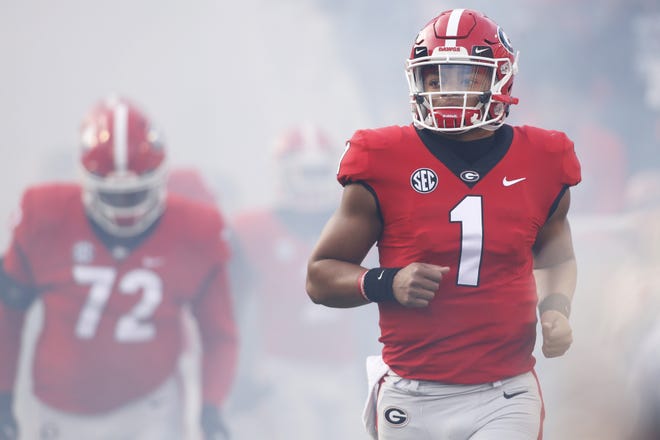 Georgia quarterback Justin Fields (1) takes the field with his teammates before the start of an NCAA college football game between Georgia and Massachusetts in Athens Ga., Saturday, Nov. 17, 2018. [Photo/Joshua L. Jones, Athens Banner-Herald]
