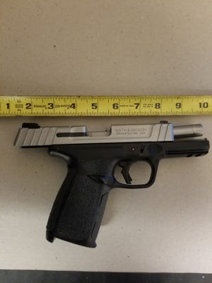 Police confiscated this Smith & Wesson 9 mm semiautomatic pistol from a man accused of shooting inside the Tradesman Center early Sunday morning. [PORTSMOUTH POLICE PHOTO]