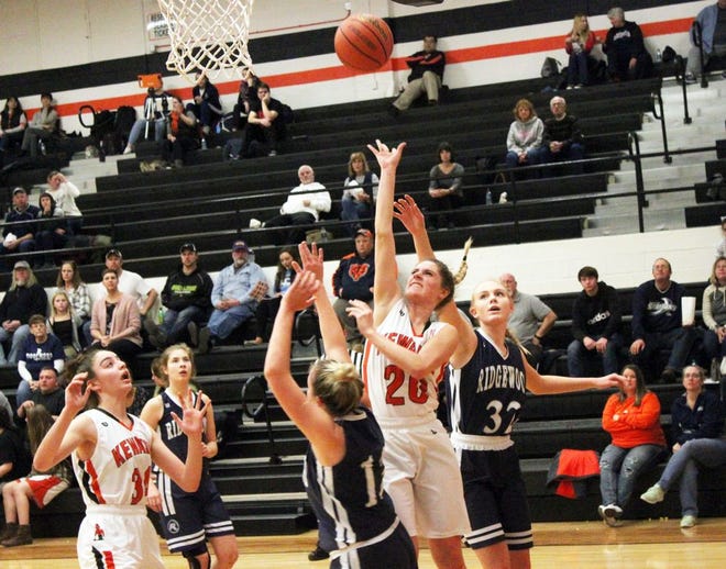 Kewanee's Isabella Tondreau (20) tosses up a floater during Monday's 53-43 win against Ridgewood.