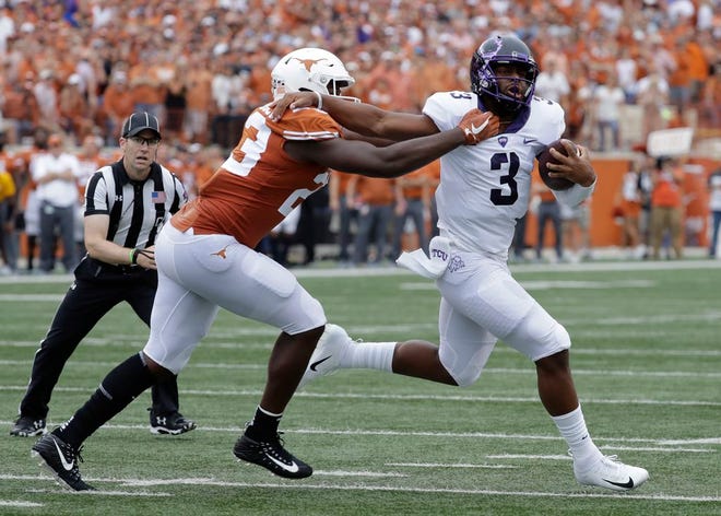 TCU quarterback Shawn Robinson (3) is sacked for a loss by Texas linebacker Jeffrey McCulloch (23) on Sept. 22. Missouri announced Tuesday that Robinson signed a financial aid agreement with the school, confirming his transfer to MU. [Eric Gay/The Associated Press]