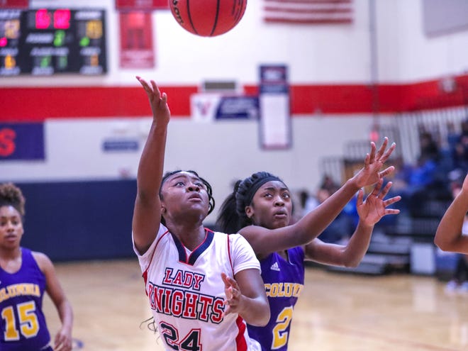 Vanguard's Nasia Powell (24) drives the basket as the Knights defeated Columbia 73-57 on Tuesday night. Powell had 32 points in the win. [Submitted photo by Chris M. Spears]