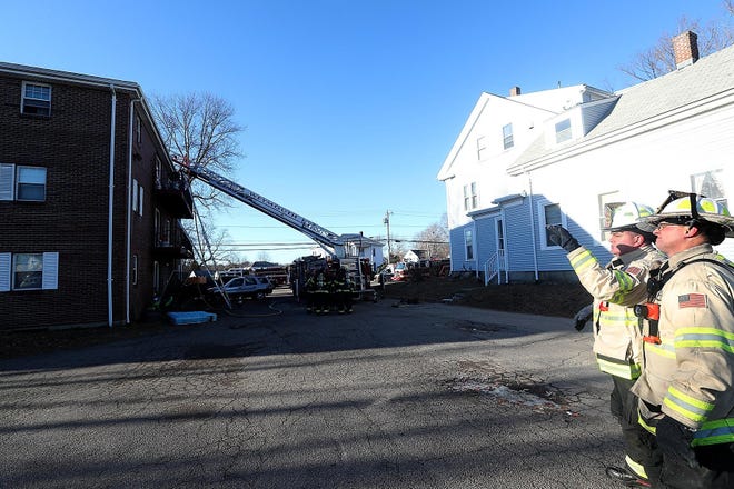 WEYMOUTH/ Weymouth fire chief Keith Stark talks with deputy Rick Chase at the scene of a fire at 46 Pond Street on Tuesday, Dec. 18, 2018. Robin Chan/ Wicked Local Weymouth