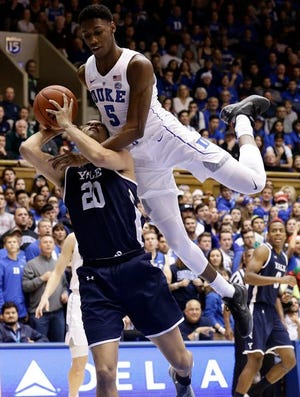Duke's RJ Barrett falls on Yale's Paul Atkinson in a game earlier this month.