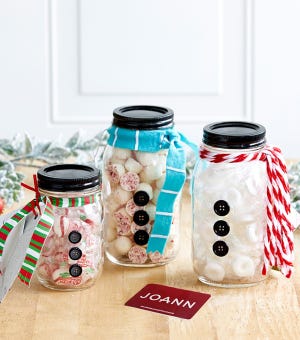 Make snowman candy jars with Mason jars, felt and spray paint. [Contributed by Jo-Ann Stores]