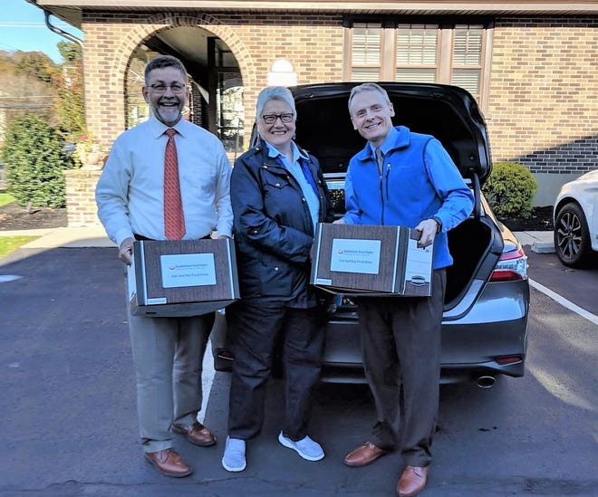 From left: Michael Kracht, partner, Weber Kracht and Chellew; Sally Lindemuth, food drive coordinator, Quakertown Food Pantry; and Richard Howard Jr., partner, Weber Kracht and Chellew. [COURTESY WEBER KRACHT AND CHELLEW]