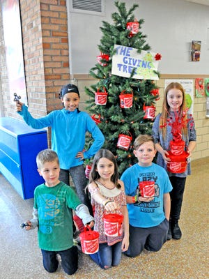 Parkview Elementary School students (l. to r., front) Caspar Halene, Brooke Lamb, Jayce Miller, from left, front row, Jay-Cee Hackett and Aubrey Hartzler have been ringing bells on site and encouraging their classmates and parents to give to the Salvation Army holiday campaign at their school as part of a leadership effort and community service.