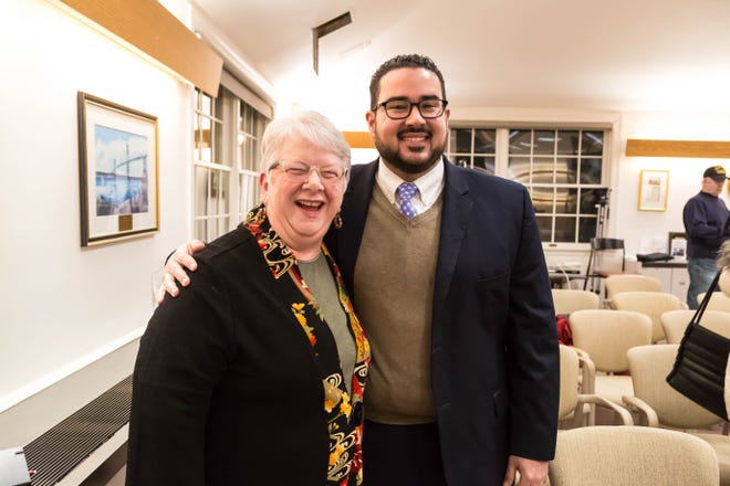 Karen Marlow McDaid and Juan Carlos Payero are all smiles Wednesday night after earning seats on the Portsmouth School Committee. They were chosen from a pool of five candidates by the Town Council. [DEB KESTLER PHOTO]