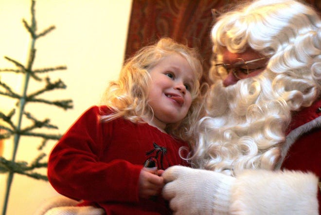 Newport, RI Sunday December 17, 2006 - A slightly nervous Bridget Peach of Providence chats with Santa Claus at The Elms mansion in Newport. The four-year-old asked him for a bouncy ball and candy, but not the gummy kind that she got for Halloween! Claus has been making appearances at various Newport mansions throughout December, and this was his last stop before Christmas. The Breakers, The Elms, and Marble House are all decorated for the holidays. [The Providence Journal, file / Connie Grosch]