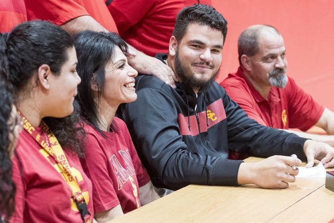 Oak Hills offensive lineman Jason Rodriguez signed to play football for USC during a rally at Oak Hills on Wednesday. [James Quigg, Daily Press]