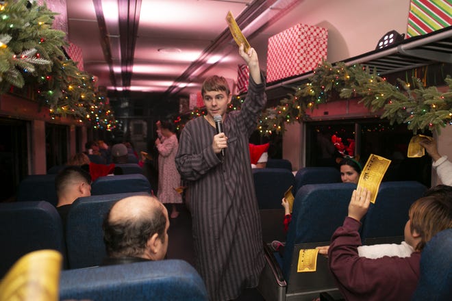 Billy, the lonely boy, asks everyone to hold up their golden ticket at The Polar Express experience in Mount Dora. [Cindy Sharp/Correspondent]