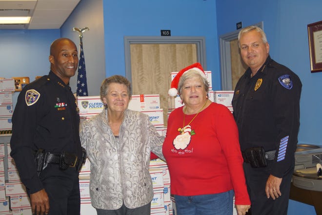 From the left, Clermont police chief Charles Broadway, Clermont mayor Gail Ash, Groveland mayor Evelyn Wilson and Groveland police chief Shawn Ramsey. [LINDA CHARLTON / CORRESPONDENT]