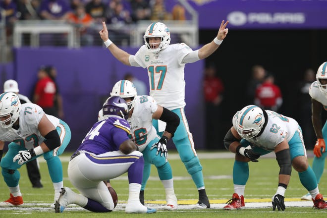 Dolphins quarterback Ryan Tannehill signals a play during the first half of a Dec. 16 game against the Vikings. [Jeff Haynes/AP Images]
