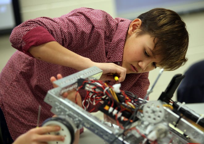 Jacob Hamrick, 13, of Kings Mountain Middle School constructs a robot at Cleveland County Central Services in Shelby on Friday. [Brittany Randolph/The Star]