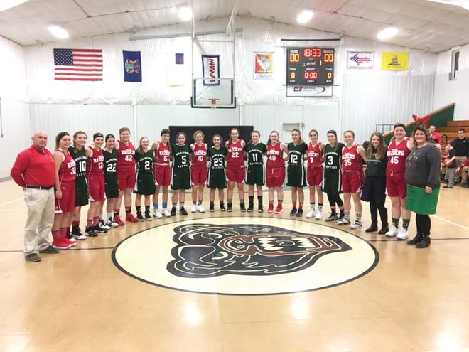 It was a Christmas-themed night as DeTour visited Maplewood Baptist for boys and girls basketball games Tuesday. The girls' teams are pictured here, with alternating red and green uniforms combining for a perfect blend of holiday colors.. Many fans wore Christmas sweaters to the games.