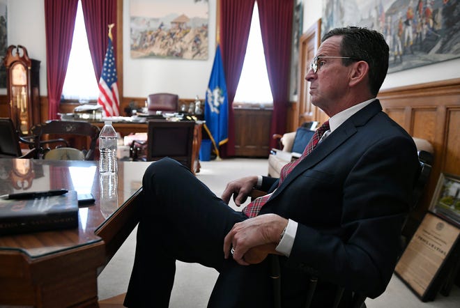 Connecticut Gov. Dannel P. Malloy speaks in an interview with The Associated Press in his office at the state Capitol in Hartford, Conn., Wednesday, Dec. 19, 2018. (AP Photo/Jessica Hill)