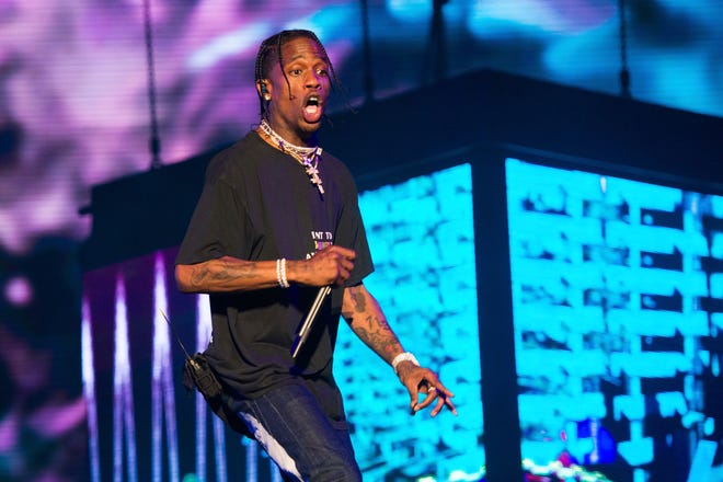 FILE - In this June 2, 2018 file photo, rapper Travis Scott performs at The Governors Ball Music Festival in New York. Scott is in talks to perform at the Super Bowl halftime in Atlanta. A person familiar with the situation, who spoke on the condition of anonymity because they were not allowed to speak about the topic publicly, said that Scott is close to signing on to perform at Super Bowl on Feb. 3 at the Mercedes-Benz Stadium. (Photo by Scott Roth/Invision/AP, FIle)