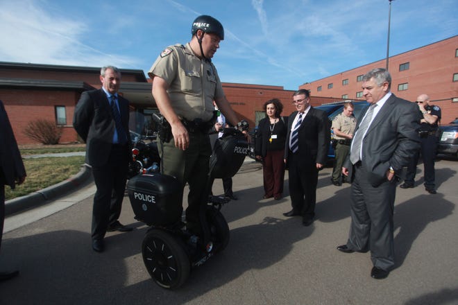 Hutchinson police officer Stephen Schaffer demonstrates a personal transport device to the Armenians in 2011. Schaffer leaves the Hutchinson Police Department on Dec. 26 to take over as the Haven police chief. [File photo]
