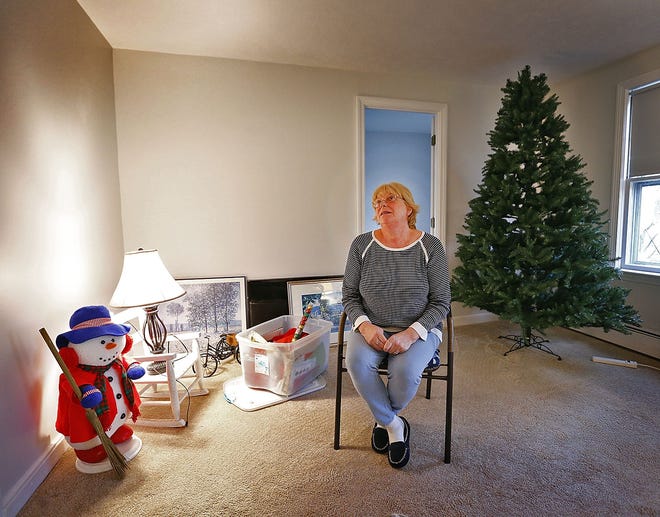 Lend a Hand, Wendy Gallagher in a small Cohasset apartment on her patio chair on Thursday , Nov.29, 2018 Greg Derr/ The Patriot Ledger
