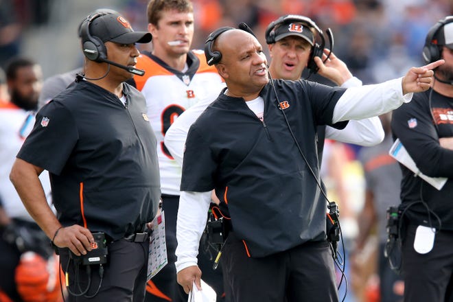 FILE - In this Dec. 9, 2018, file photo, Cincinnati Bengals special assistant to the head coach Hue Jackson, right, points something out to head coach Marvin Lewis during the second quarter of an NFL football game against the Los Angeles Chargers in Carson, Calif. Jackson returns to Cleveland on Sunday, for the first time since he was fired by the Browns on Oct. 29. (Kareem Elgazzar/The Cincinnati Enquirer via AP, File)