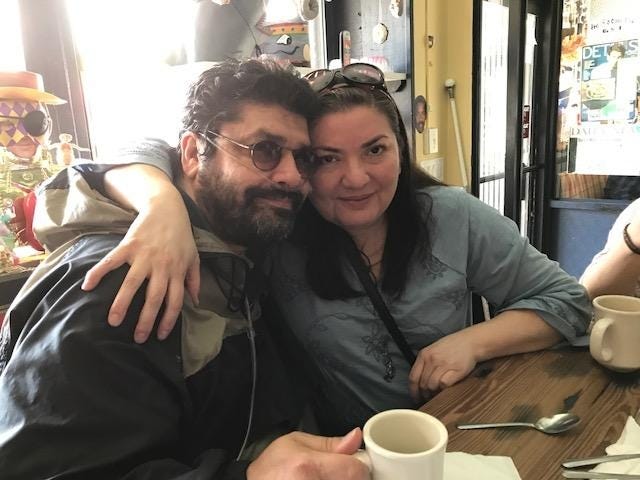 Alberto Colombani(left) and his wife Judith pose for a photo at a local restaurant. (Photo Provided)