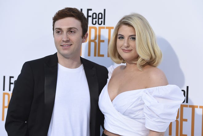 Meghan Trainor, right, and Daryl Sabara arrive at the world premiere of "I Feel Pretty" at the Westwood Village Theater in Los Angeles on April 17, 2018. [Photo by Jordan Strauss/Invision/AP, File]