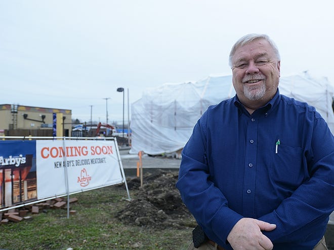 Alliance Area Chamber of Commerce President Mark Locke in front of the building that will become the new Arby's located between Sheetz and Taco Bell on Thursday, Dec. 20.