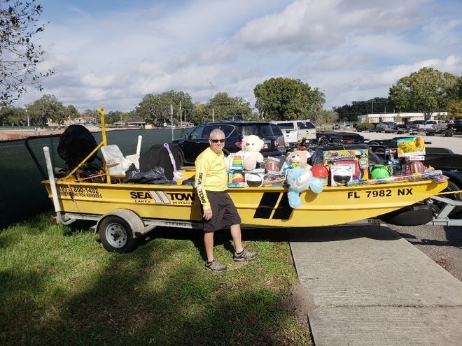 Sea Tow's holiday drive brought in 3,600 pounds of toys and $5,400 in cash donations for Toys for Tots of Lake and Sumter Counties. [Submitted]