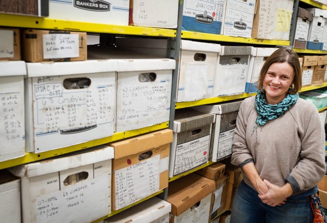 St. Augustine city archaeologist Andrea White stands next to shelves of boxes in her office containing items uncovered during archaeological digs in the city. [PETER WILLOTT/THE RECORD]
