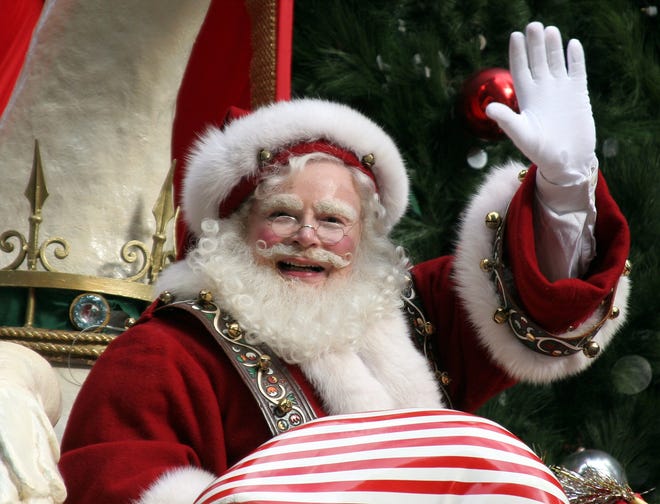 Santa Claus waves from his sleigh as he makes his way down Broadway during the Macy's Thanksgiving Day parade. [AP Photo/Mary Schwalm, File]