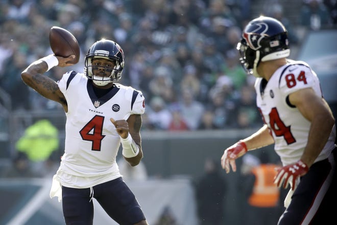 Houston Texans' Deshaun Watson passes as Ryan Griffin looks during the team's 32-30 loss to the Philadelphia Eagles Sunday. The Texans are the first teams in 20 years to make the postseason after a 0-3 start. [AP Photo/Matt Rourke]