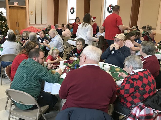 More than 100 people filled the 45th annual free Christmas Day dinner Tuesday at the First Presbyterian Church. [Jeff Smith/The Leader]