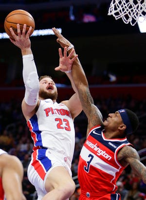 Detroit Pistons forward Blake Griffin (23) goes to the basket against Washington Wizards guard Bradley Beal (3) during the first half of an NBA basketball game Wednesday, Dec. 26, 2018, in Detroit. (AP Photo/Duane Burleson)