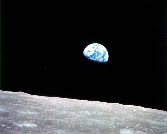 Fifty years ago this week. the Apollo 8 spacecraft became the first crewed mission to orbit the Moon. Astronauts Frank Borman, Bill Anders and Jim Lovell entered lunar orbit on Dec. 24 and held a live broadcast, showing pictures of Earth and the Moon as seen from the spacecraft and reading from the book of Genesis. The mission became famous for capturing this iconic “Earthrise” photograph, snapped by Anders as the spacecraft was in the process of rotating. MUST CREDIT: NASA