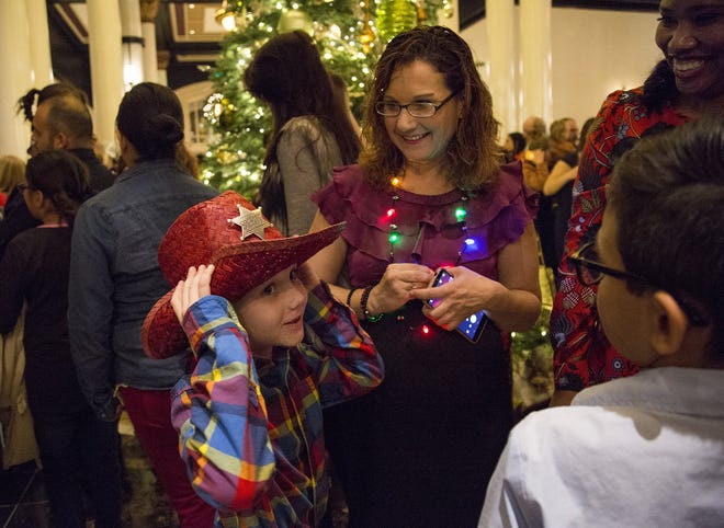 Jennifer Tate and her son Brennan, 7, lighted the Driskill Hotel Christmas tree in November and were treated to a night at the hotel. This month they moved into a house with the help of Season for Caring donations. [ANA RAMIREZ/AMERICAN-STATESMAN]