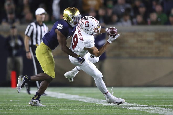 Notre Dame defensive back Troy Pride Jr., a Greer High graduate, puts a hit on Stanford's J.J. Arcega-Whiteside, a Dorman product, during a Sept. 29 game in South Bend, Ind. Pride and the Fighting Irish take on Clemson in the Cotton Bowl Saturday in Dallas. [File/AP]
