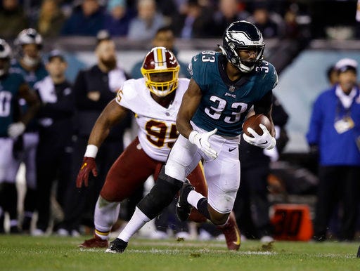 FILE - In this Dec. 3, 2018, file photo, Philadelphia Eagles' Josh Adams (33) carries against the Washington Redskins during an NFL football game in Philadelphia. Undrafted rookie Adams has emerged as Philadelphia's leading rusher. The Eagles play the Redskins again this week. (AP Photo/Matt Rourke, File)