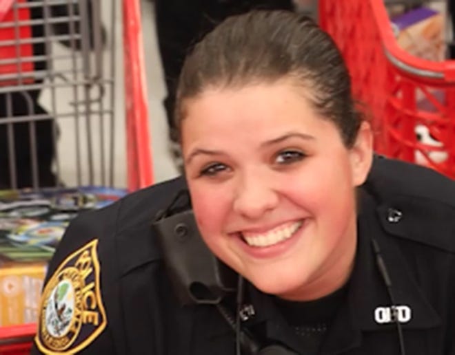 Ocala Police Officer Alyssa Garcia, shown during a recent Shop-with-a-Cop event, used Narcan to revive two people from drug overdoses. [OPD via Facebook]