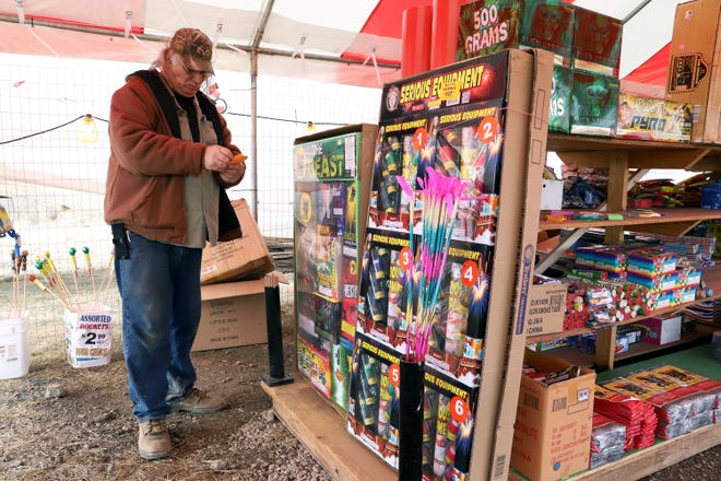 Roger Brumley sets out price tags Wednesday, Dec. 26, 2018, at A1 Fireworks at the intersection of U.S. 71 S. and Old Highway 71. A1 Fireworks will be open 9 a.m. to midnight through Jan. 1. Fireworks may not be sold or discharged in Fort Smith city limits but can be discharged in Sebastian County. [JAMIE MITCHELL/TIMES RECORD]