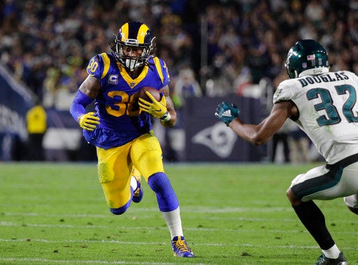 File-This photo taken Dec. 16, 2018, shows Los Angeles Rams' Todd Gurley carrying the ball during an NFL football game against the Philadelphia Eagles in Los Angeles. Gurley has been ruled out of Los Angeles’ regular-season finale Sunday, Dec. 30, 2018, against San Francisco with a knee injury. Gurley will miss the Rams’ final two games of the regular season due to the injury, but McVay says he isn’t concerned about the star running back’s availability for the playoffs. (AP Photo/Jae C. Hong, File)