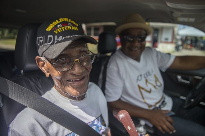 Richard Overton an Army veteran who served in the South Pacific, including Guam and Iwo Jima. poses with longtime caregiver, Martin Wilford as they looks on at the Juneteenth Parade on Saturday, June 16, 2018. Juneteenth, also known as Juneteenth Independence Day or Freedom Day is a holiday in the United States that commemorates the announcement of the abolition of slavery in the U.S. state of Texas in June 1865, and more generally the emancipation of African-American slaves throughout the Confederate South.RICARDO B. BRAZZIELL / AMERICAN-STATESMAN