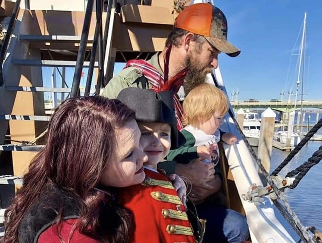 Grayson Shaver (red coat) with his mother Breanna Shaver, father Scott Shaver and younger brother during a recent outing on the Black Raven ship in St. Augustine. [CONTRIBUTED]